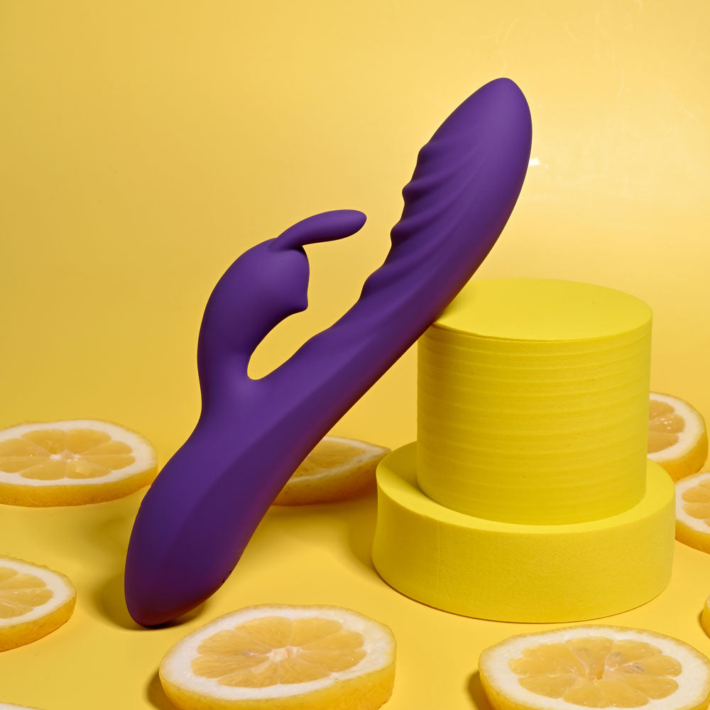 Evolved WAVY RABBIT -  20.6 cm USB Rechargeable Rabbit Vibrator displayed against a yellow backdrop with lemon slices.
