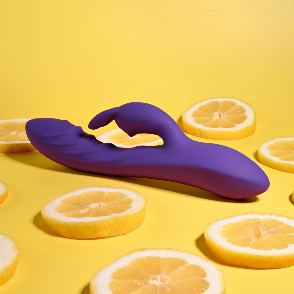 Evolved WAVY RABBIT - 20.6 cm USB Rechargeable Rabbit Vibrator surrounded by lemon slices, colorful and playful.