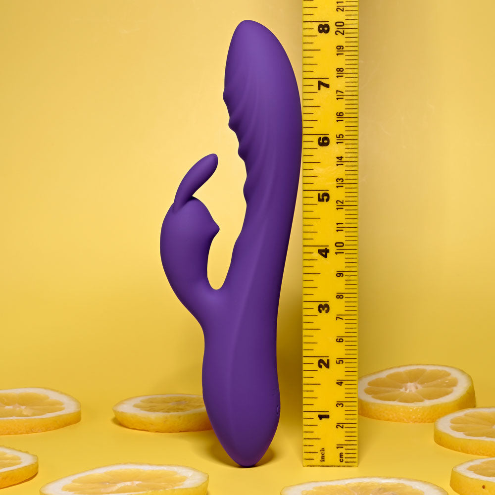 Evolved WAVY RABBIT - 20.6 cm USB Rechargeable Rabbit Vibrator against a measuring tape on a lemon background.