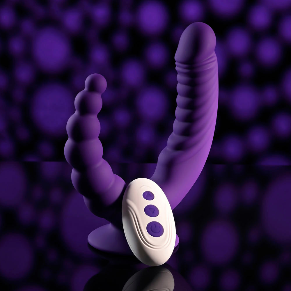 Evolved THE RIDER -  USB Rechargeable Double Ended Vibrator with Wireless Remote on a reflective surface with a purple background.
