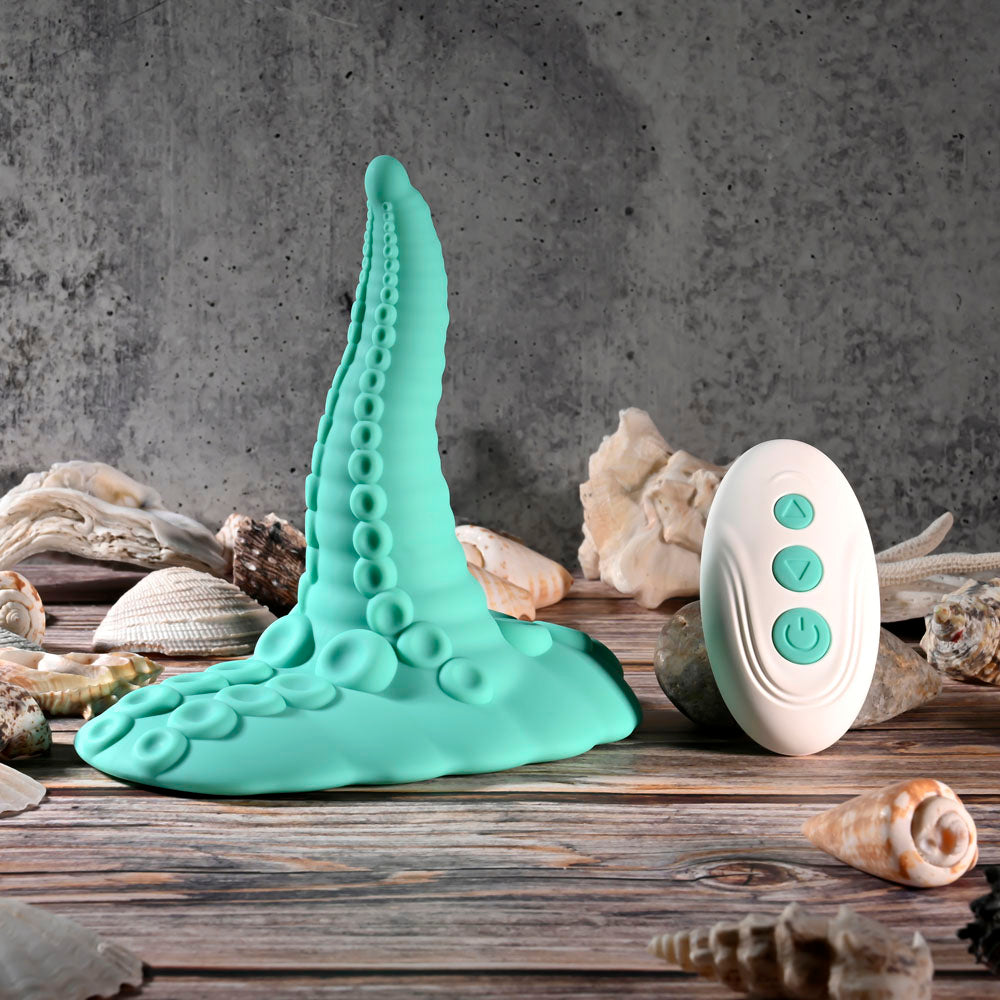 Evolved TENTACLE GRINDER -  USB Rechargeable Fantasy Grinder Pad with Wireless Remote on a wooden surface with shells.
