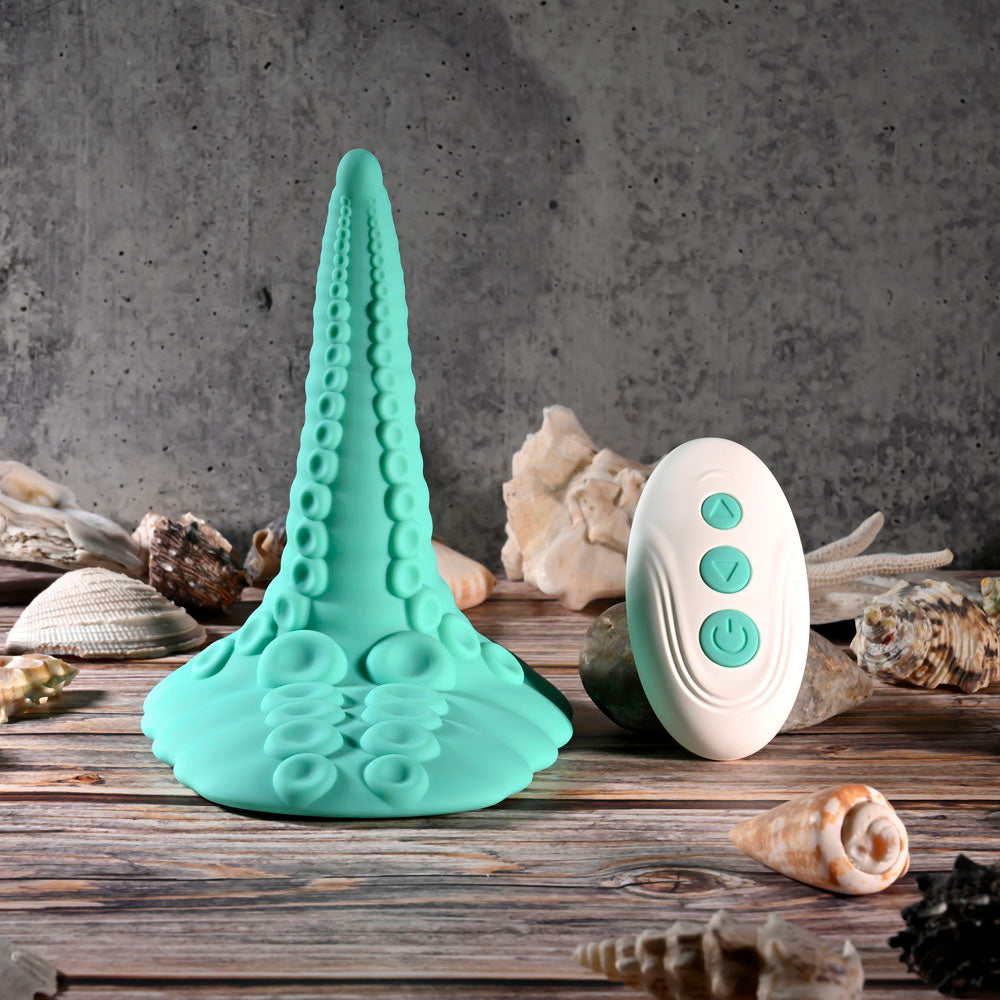 Evolved TENTACLE GRINDER - USB Rechargeable Fantasy Grinder Pad with Wireless Remote on a wooden surface.
