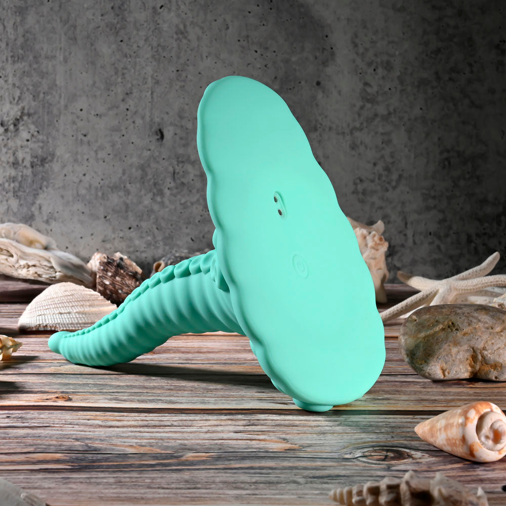 Evolved TENTACLE GRINDER -  USB Rechargeable Fantasy Grinder Pad with Wireless Remote on a wooden surface with seashells.