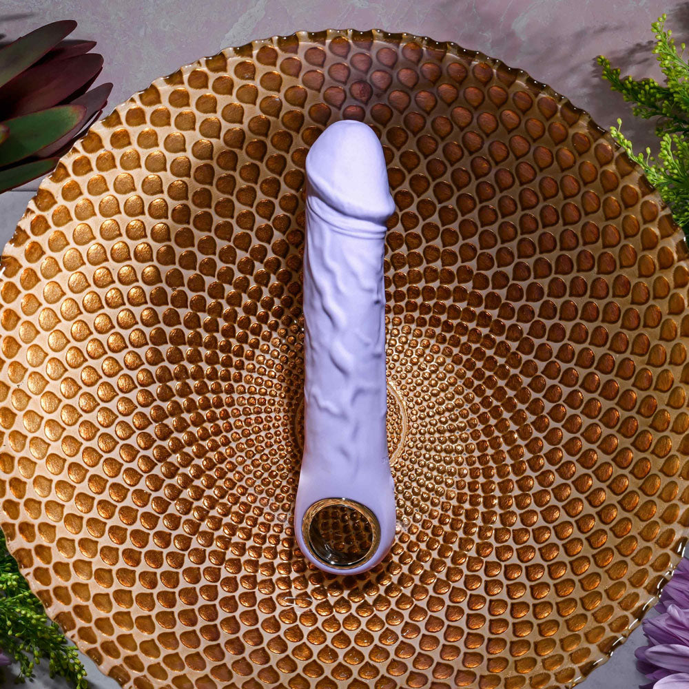 Evolved  FANTASY -  18.4 cm USB Rechargeable Vibrator displayed on a decorative plate with a textured design.