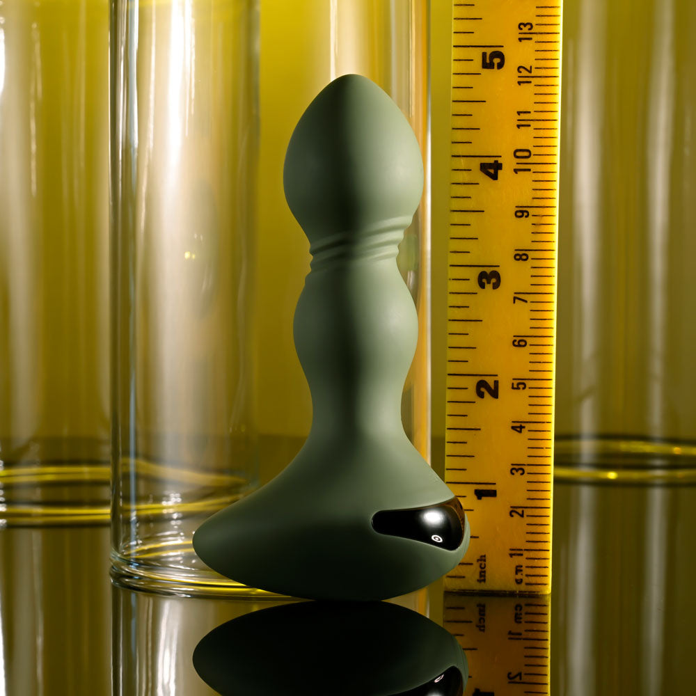 Evolved LIEUTENANT - 12.2 cm USB Rechargeable Vibrating Butt Plug displayed beside a measuring tape for size reference.