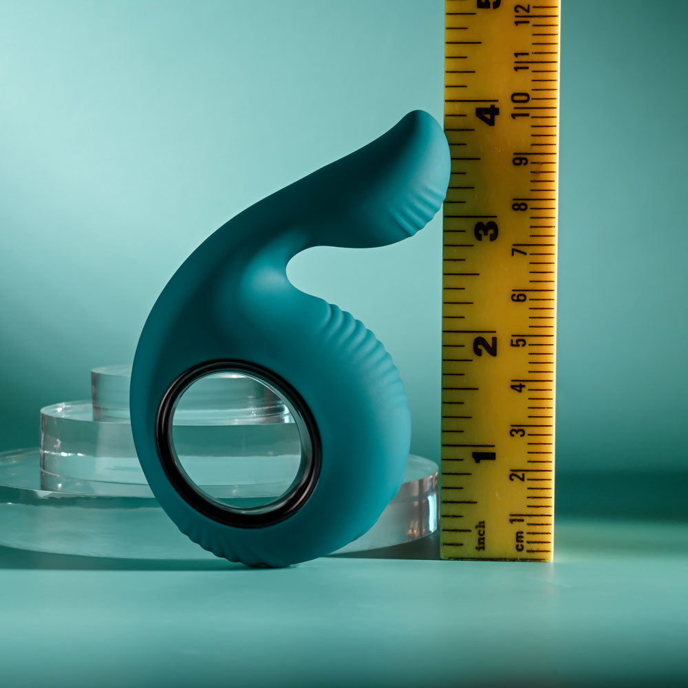Evolved THUMBS UP -  USB Rechargeable Stimulator next to a measuring ruler for size reference.