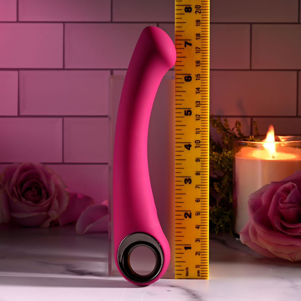 Evolved PLEASURE CURVE - 19 cm USB Rechargeable Vibrator with a pink silicone design and measuring ruler for size reference.