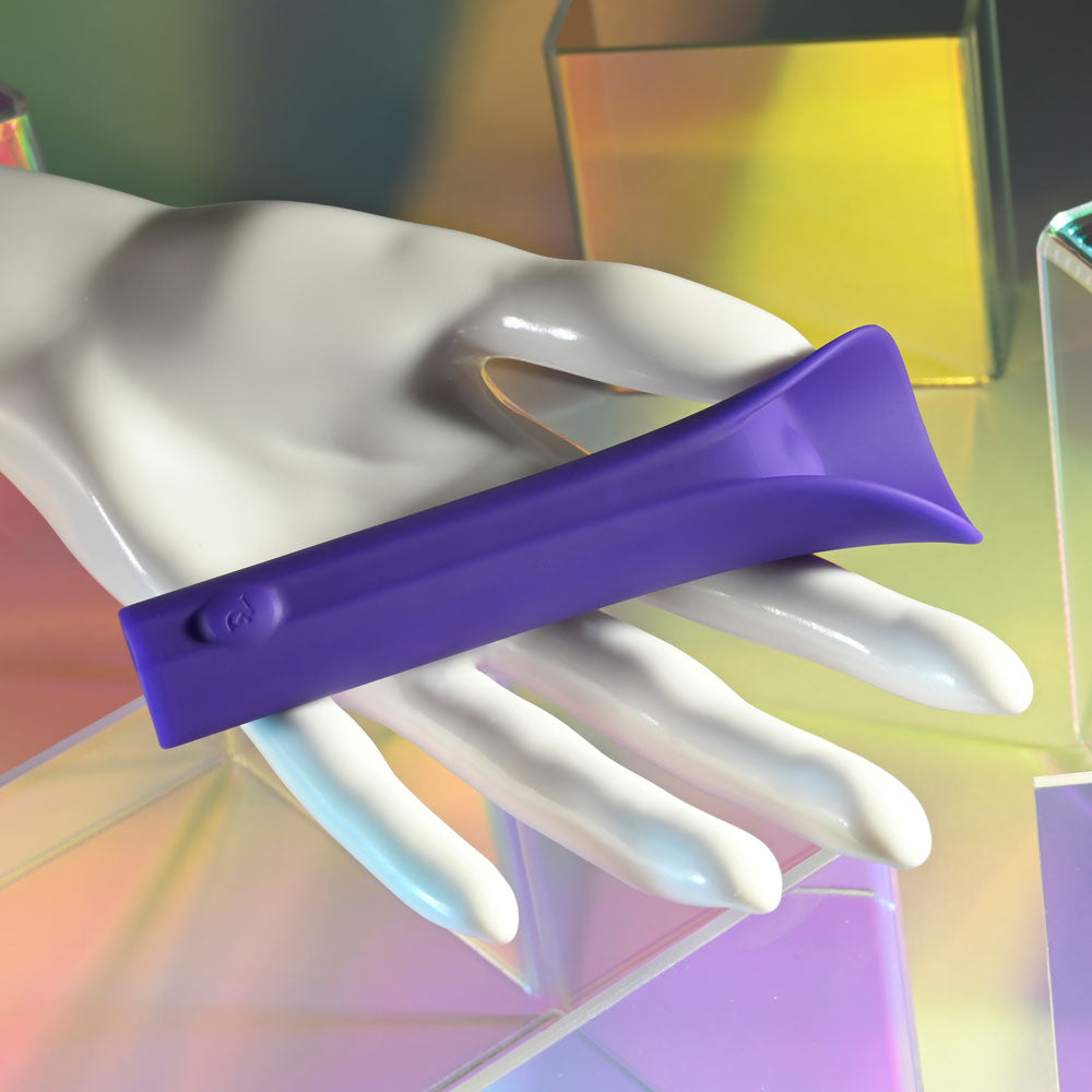 Evolved FULL COVERAGE - 11.9 cm USB Rechargeable Bullet showcased on a hand against a colorful background.