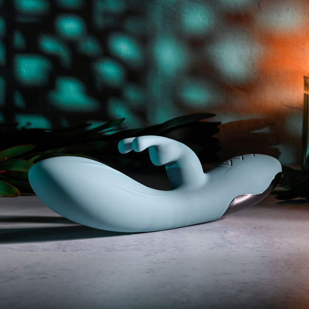 Evolved BOSS BUNNY - Baby 20.1 cm USB Rechargeable Rabbit Vibrator on a textured surface.