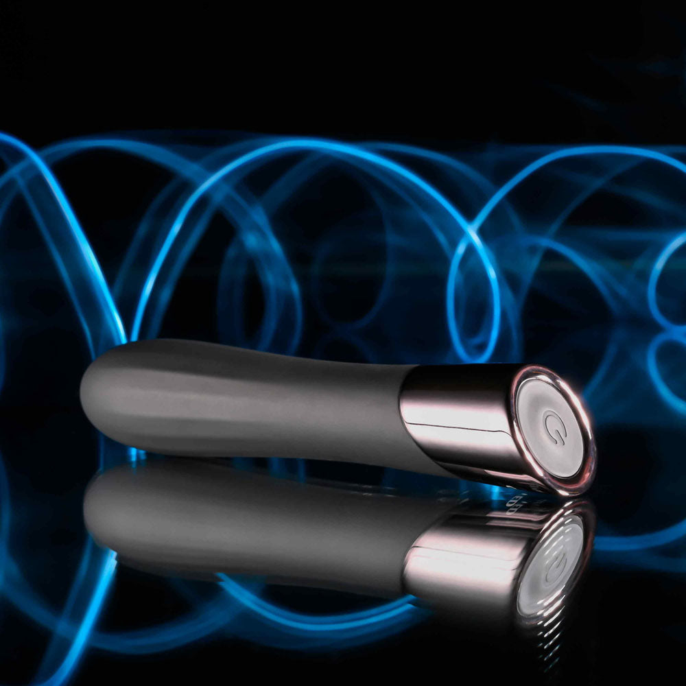Evolved BACK IN  - 11.9 cm USB Rechargeable Bullet on a reflective surface with blue light trails.