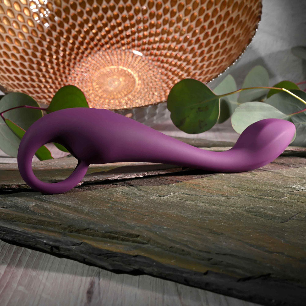 Evolved LOCHNESS G -  19 cm USB Rechargeable Vibrator on display with decorative elements.