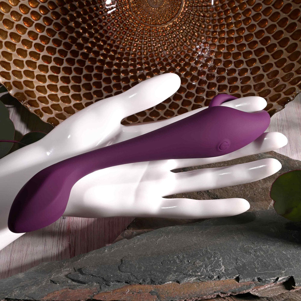 Evolved LOCHNESS G - 19 cm USB Rechargeable Vibrator displayed on a hand, showcasing its sleek design and vibrant color.
