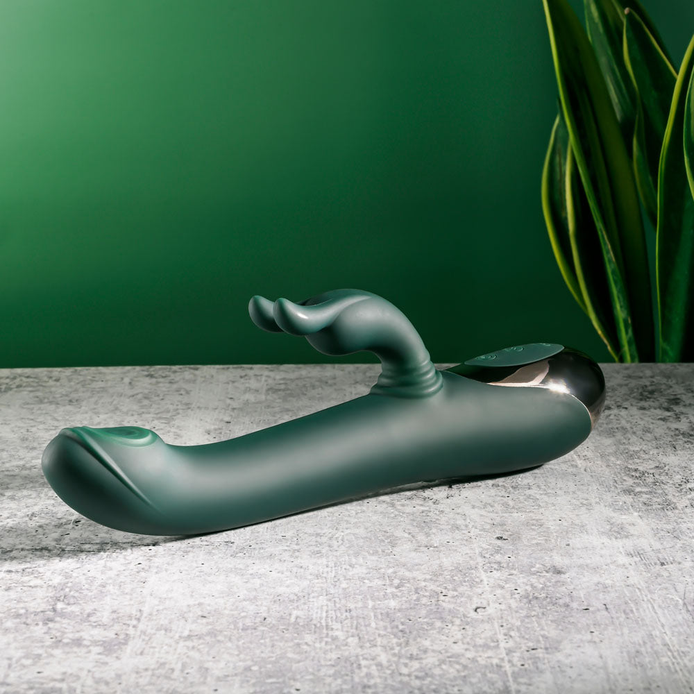 Evolved RABBIT TAP TAP - 25 cm USB Rechargeable Rabbit Vibrator with Tapping Tip on a textured surface.