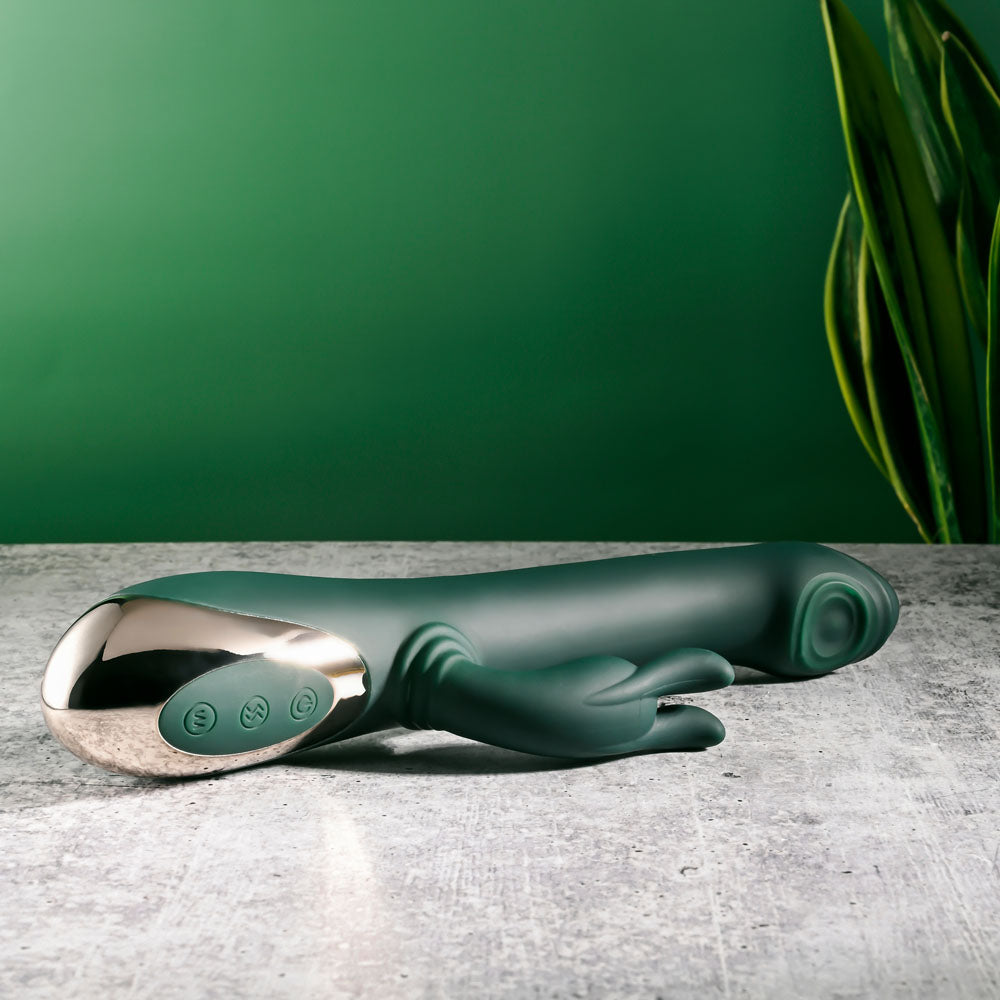 Evolved RABBIT TAP TAP - 25 cm USB Rechargeable Rabbit Vibrator with Tapping Tip on a textured surface.
