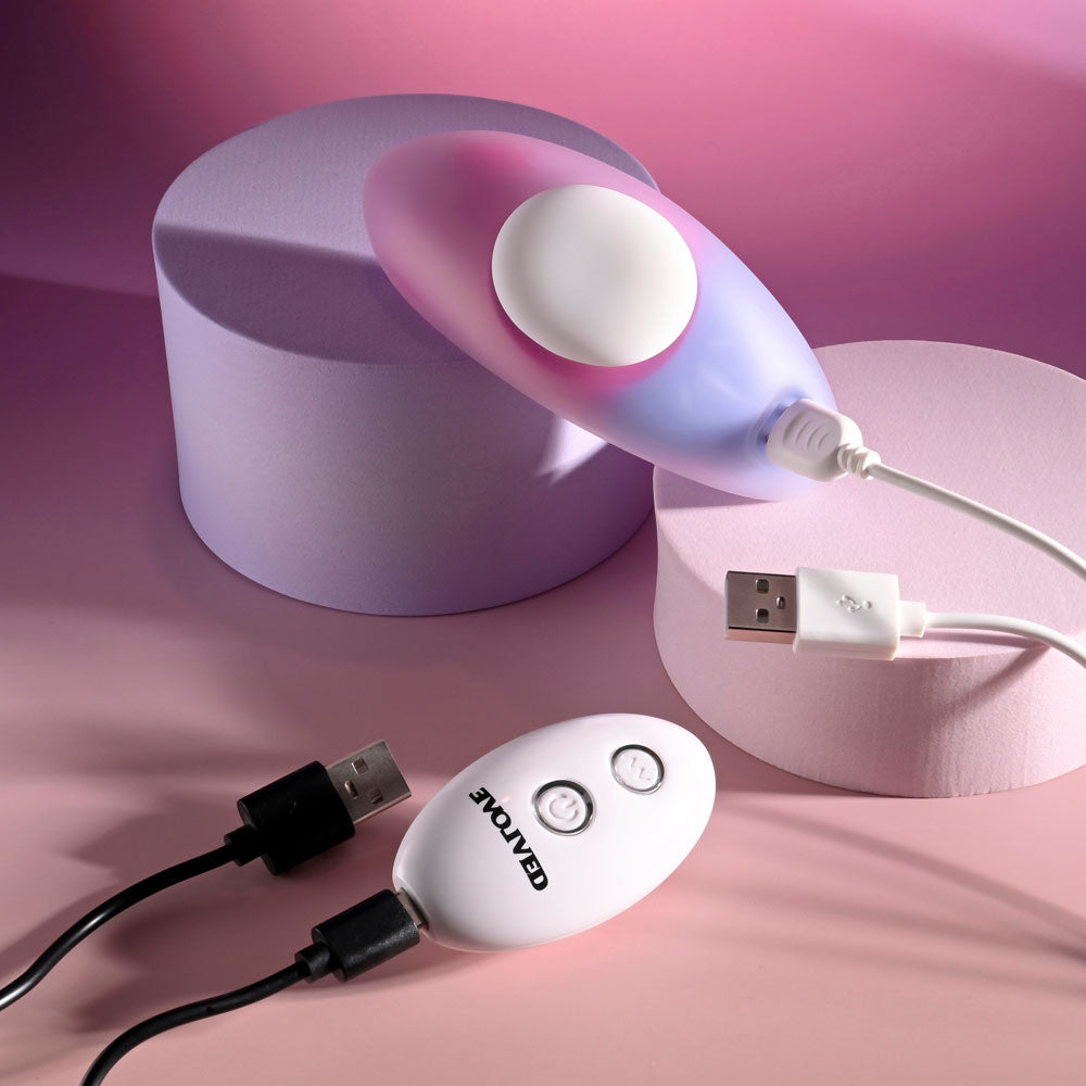 Evolved PARADISE PANTY - Pink/Purple USB Rechargeable Panty Vibrator with Remote Control on pastel background.