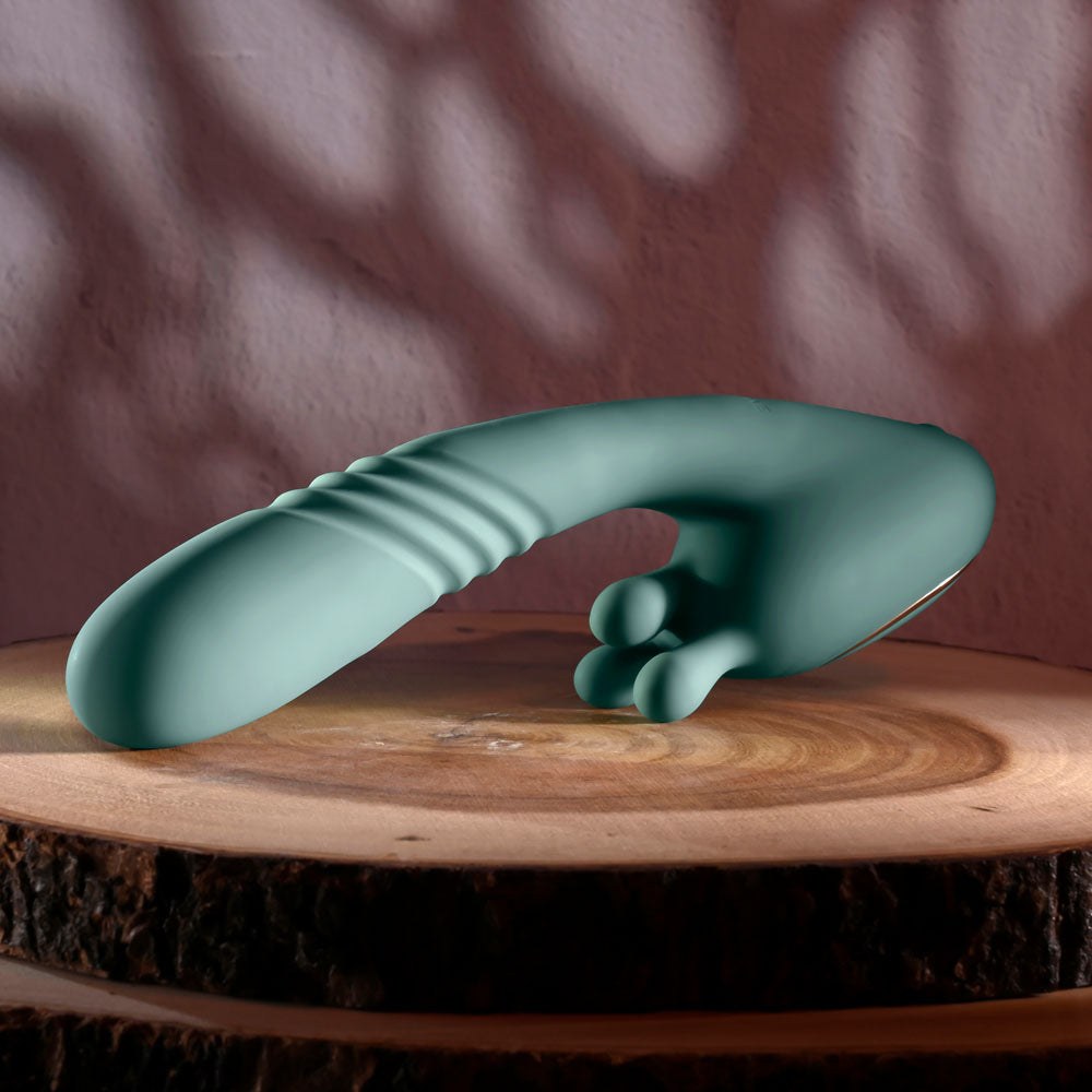 Evolved THRUST INTO ECSTASY - 21 cm USB Rechargeable Thrusting & Rotating Vibrator displayed on wooden surface.