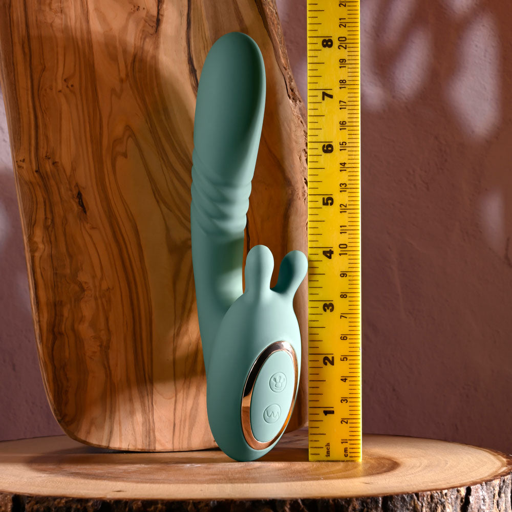 Evolved THRUST INTO ECSTASY - 21 cm USB Rechargeable Thrusting & Rotating Vibrator on display with measuring tape.