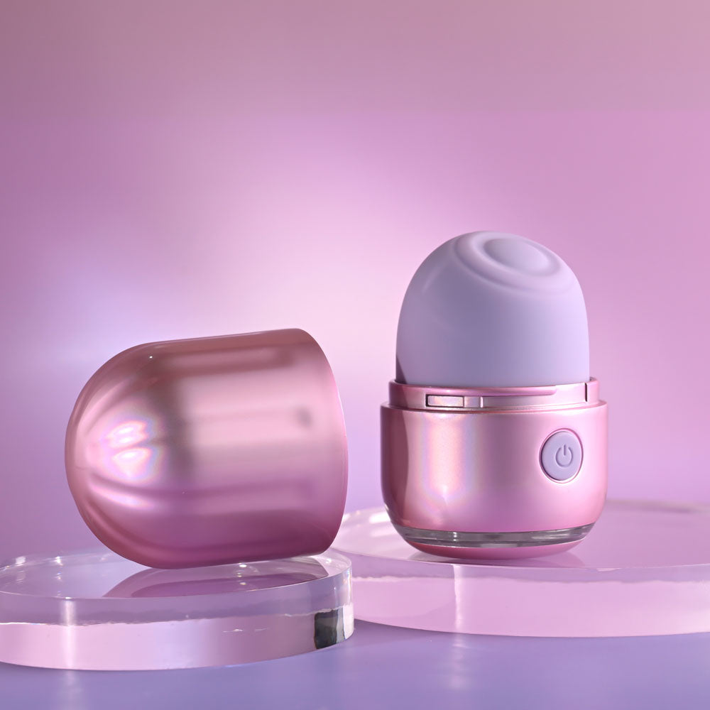 Evolved VACATION VIBES USB rechargeable tapping stimulator with iridescent design and silicone tapping head.