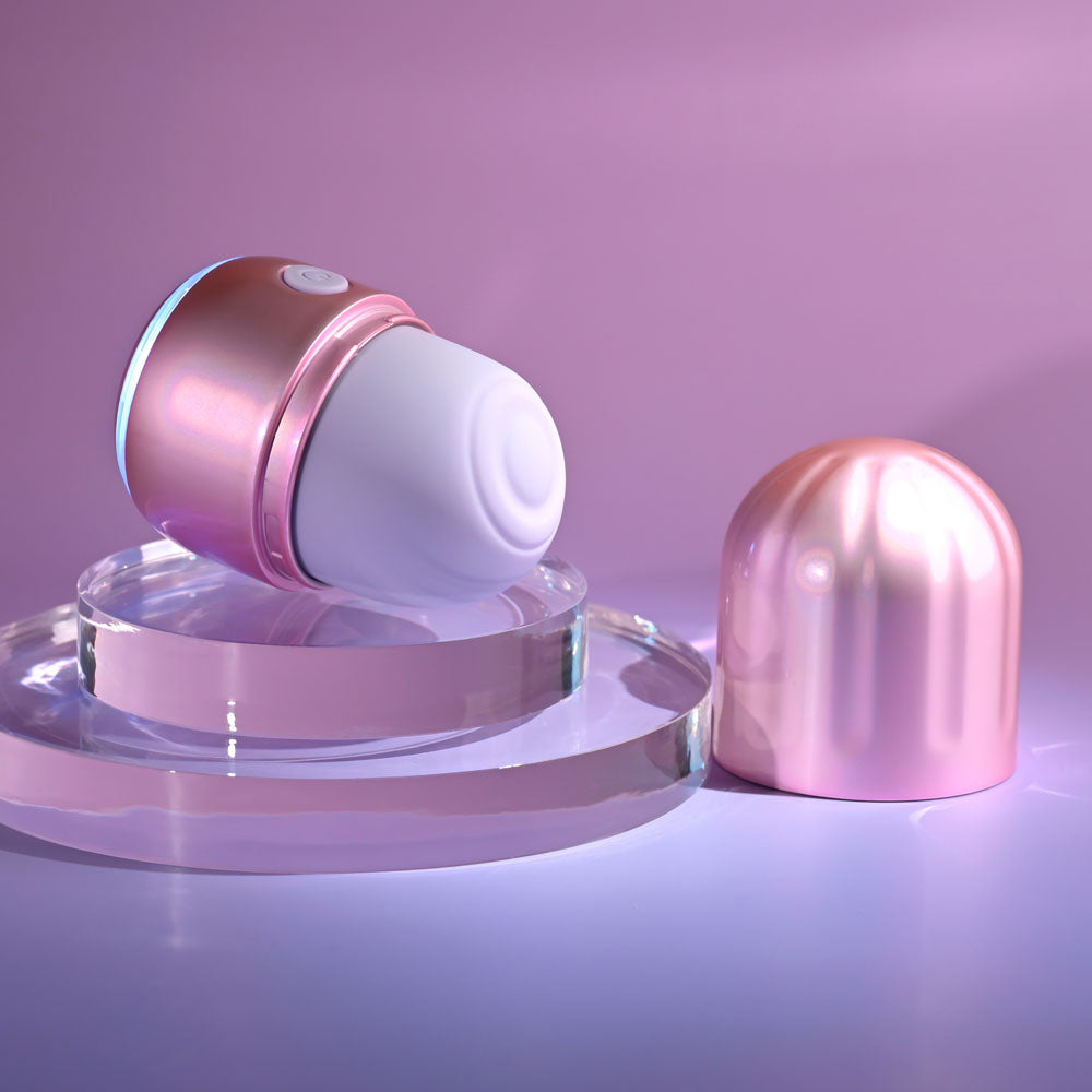 Evolved VACATION VIBES - TAPPING -  8.5 cm USB Rechargeable Tapping Stimulator on a glossy surface with lid off.