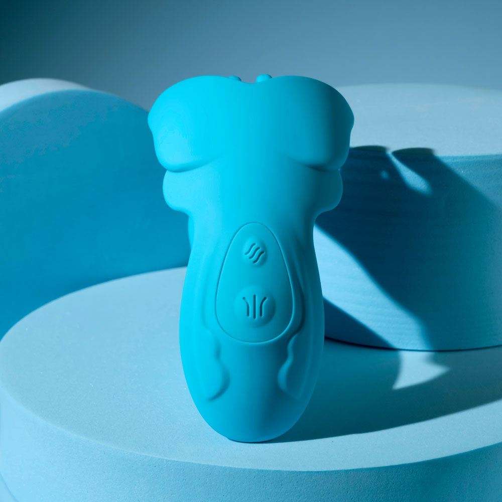 Evolved SPREAD YOUR WINGS -  USB Rechargeable Wearable Butterfly Vibrator on a blue background.