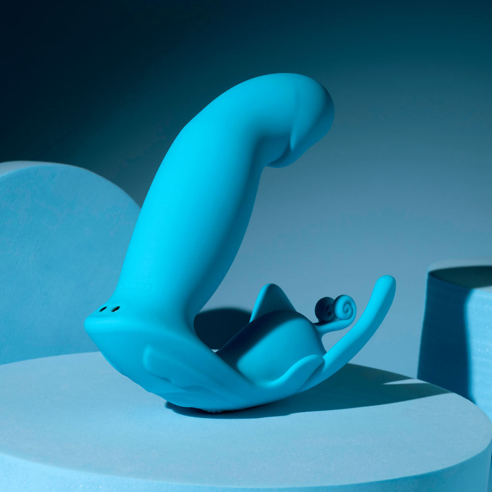 Evolved SPREAD YOUR WINGS - USB Rechargeable Wearable Butterfly Vibrator on a blue background.