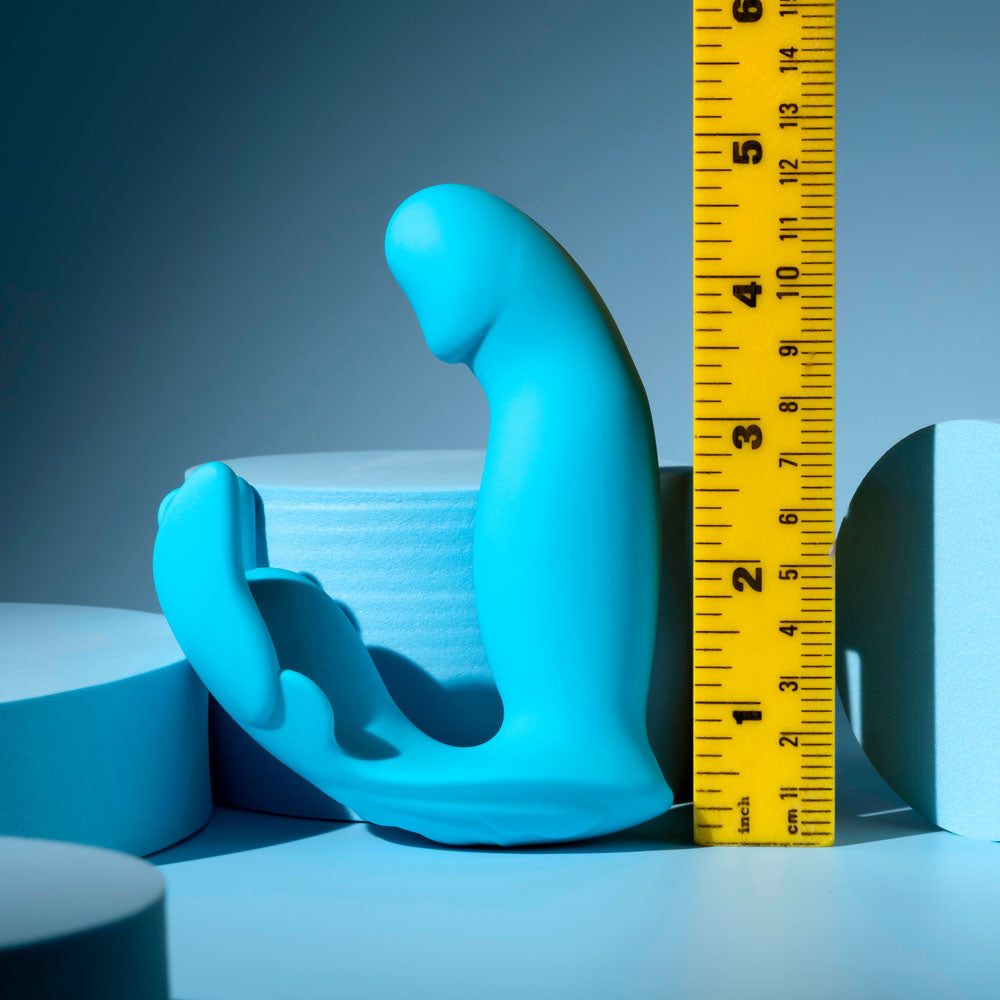 Evolved SPREAD YOUR WINGS -  USB Rechargeable Wearable Butterfly Vibrator next to a ruler for size reference.