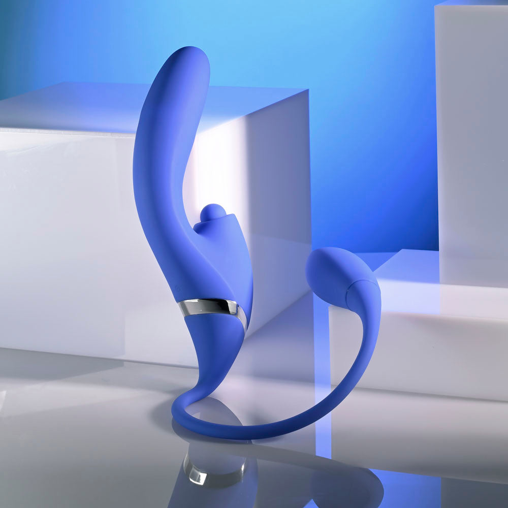 Evolved ALL IN -  USB Rechargeable Triple Stimulating Vibrator in blue with a sleek design on a reflective surface.