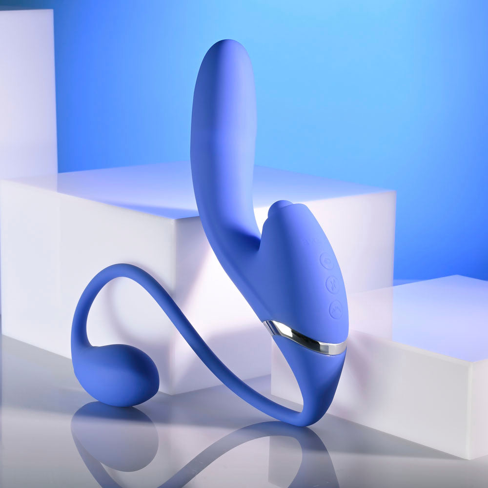 Evolved ALL IN -  USB Rechargeable Triple Stimulating Vibrator against a blue background showcasing its flexible design.