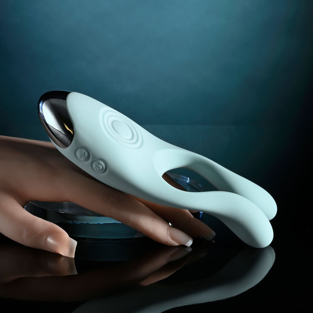 Evolved COUPLES THERAPY - Teal USB Rechargeable Couples Stimulator resting on a hand.