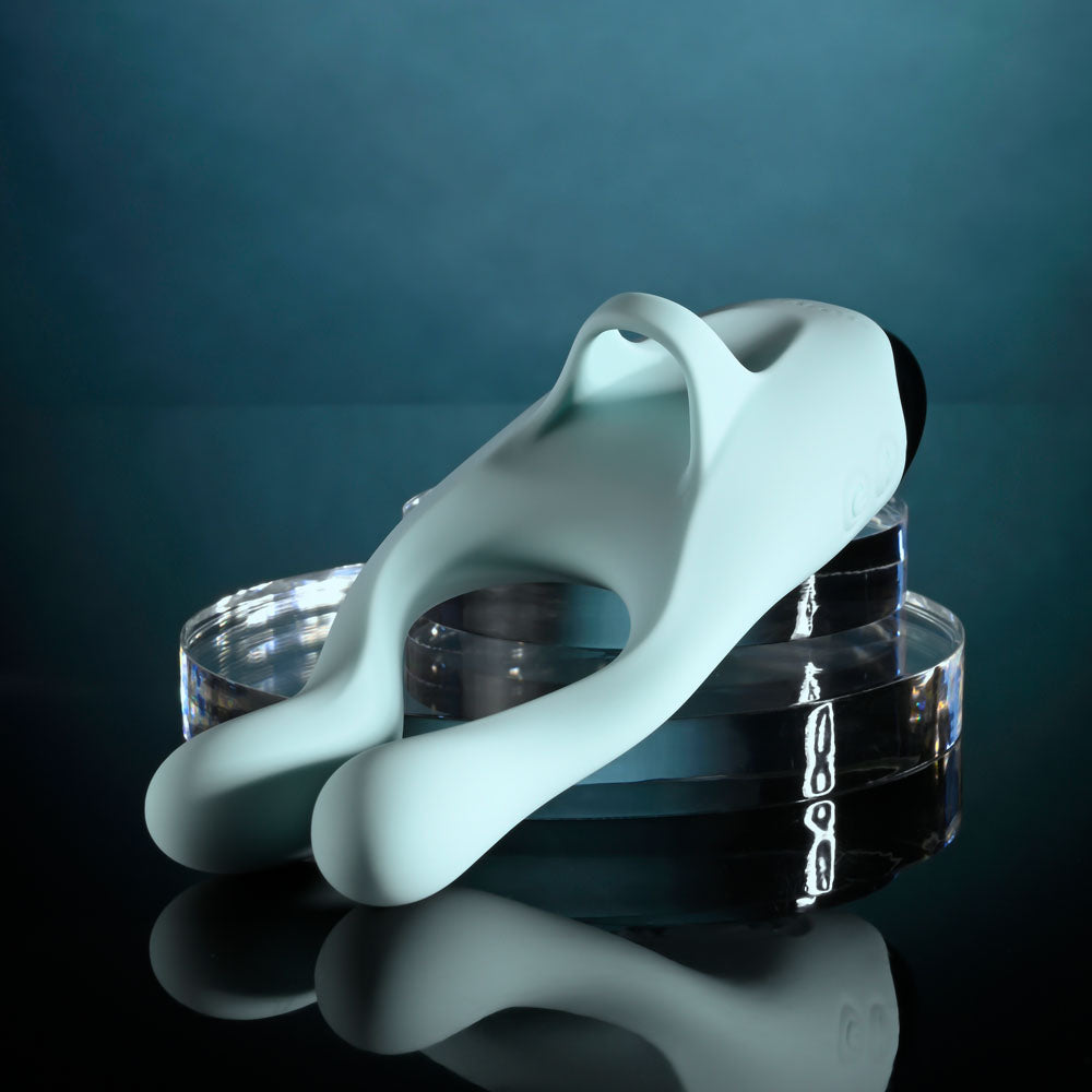 Evolved COUPLES THERAPY - Teal USB Rechargeable Couples Stimulator on a reflective surface.