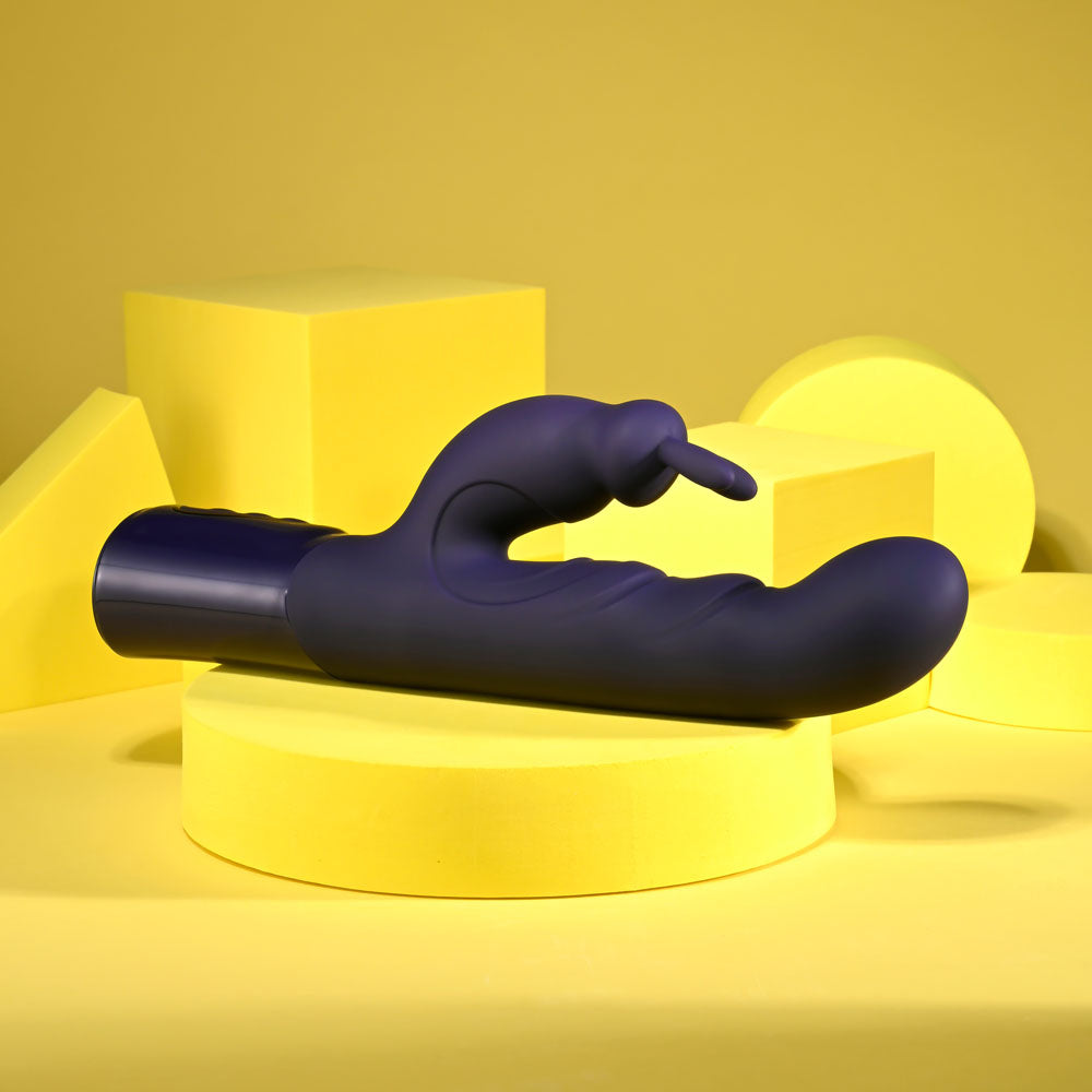 Evolved BIG DEAL - 25.7 cm USB Rechargeable Rabbit Vibrator against a bright yellow background.