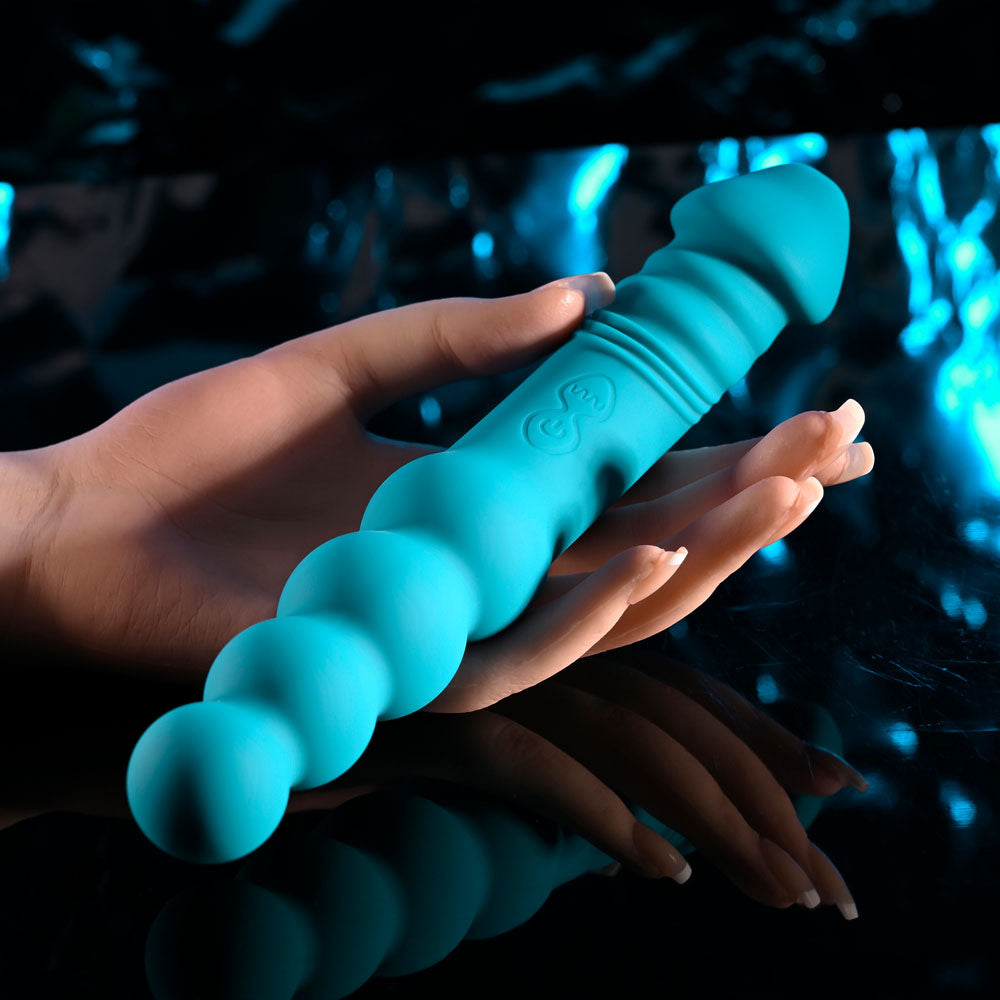 Evolved FLIP FLOP -  23.1 cm USB Rechargeable Dual Ended Vibrator in a hand, showcasing its textured and beaded design.