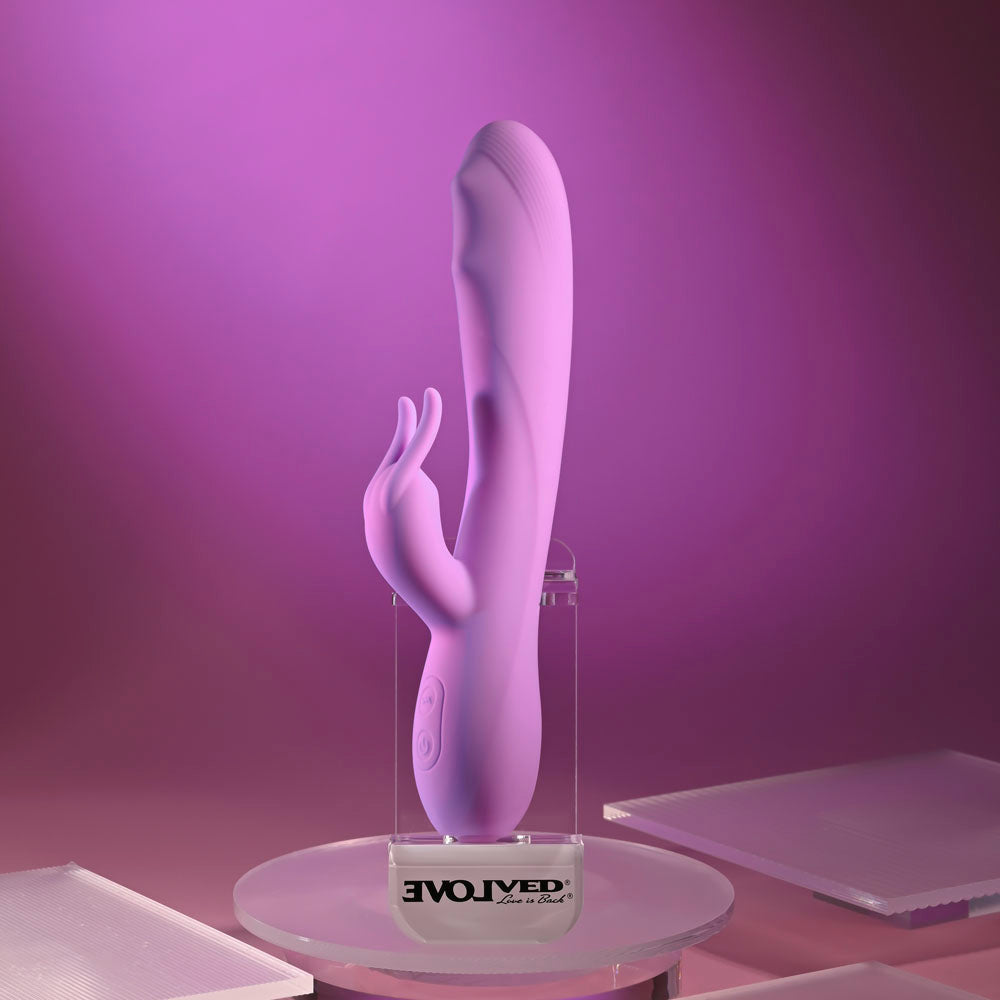 Evolved BEAD THE WAY - 23.2 cm USB Rechargeable Rabbit Vibrator in purple on a display with soft lighting.