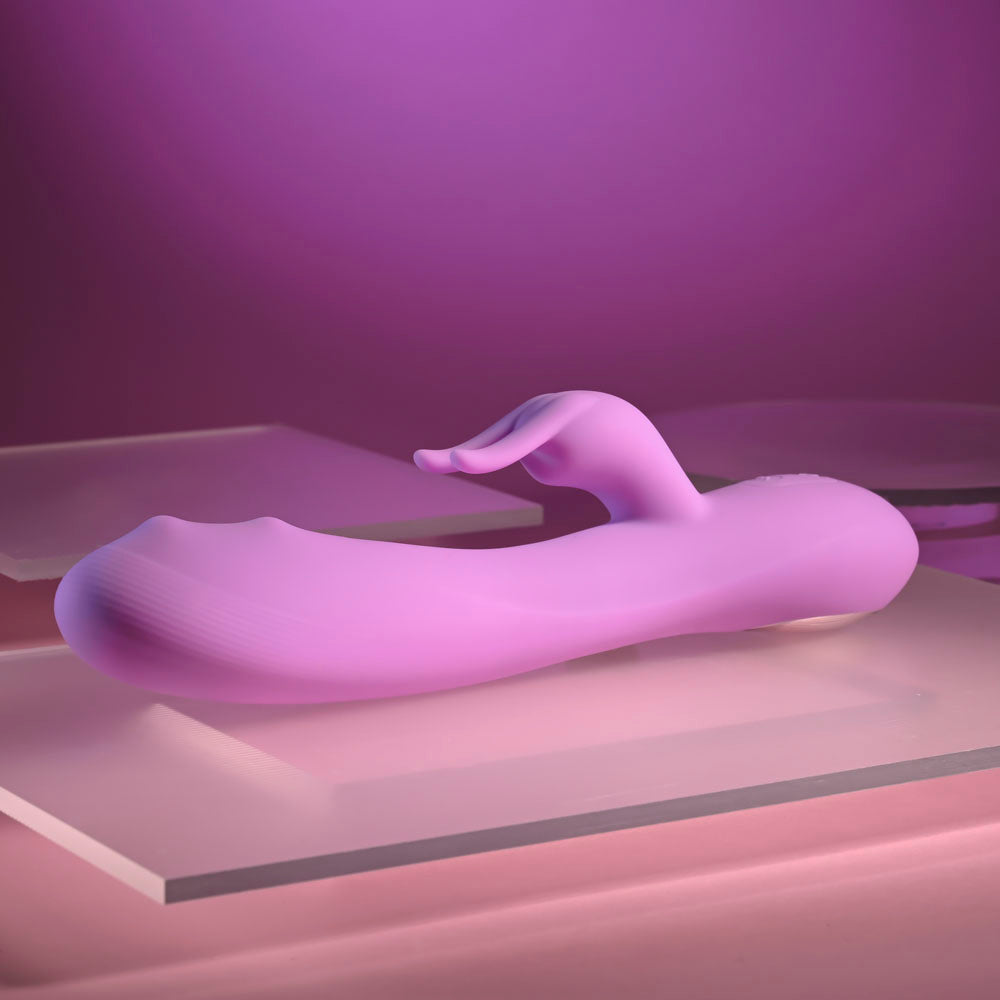 Evolved BEAD THE WAY -  23.2 cm USB Rechargeable Rabbit Vibrator in soft silicone on a reflective surface.