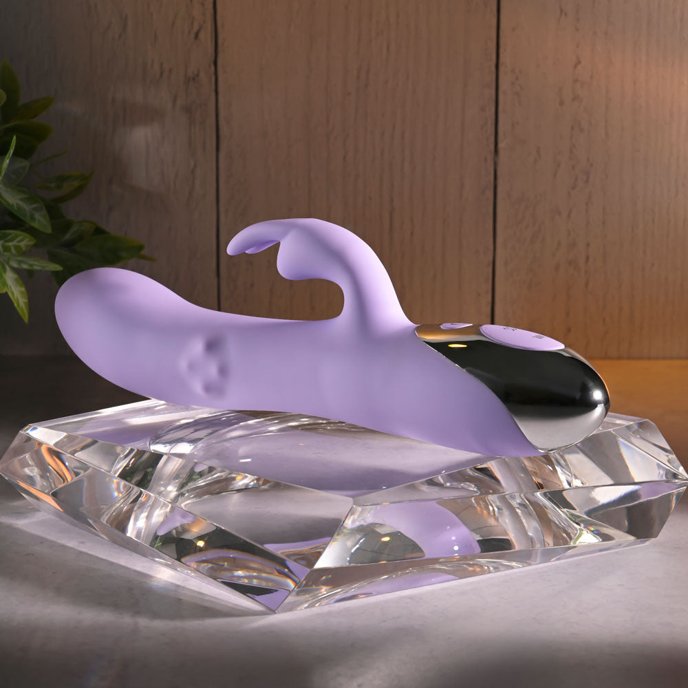 Evolved SPINDERELLA -  USB Rechargeable Rabbit Vibrator displayed elegantly on a crystal-like base.