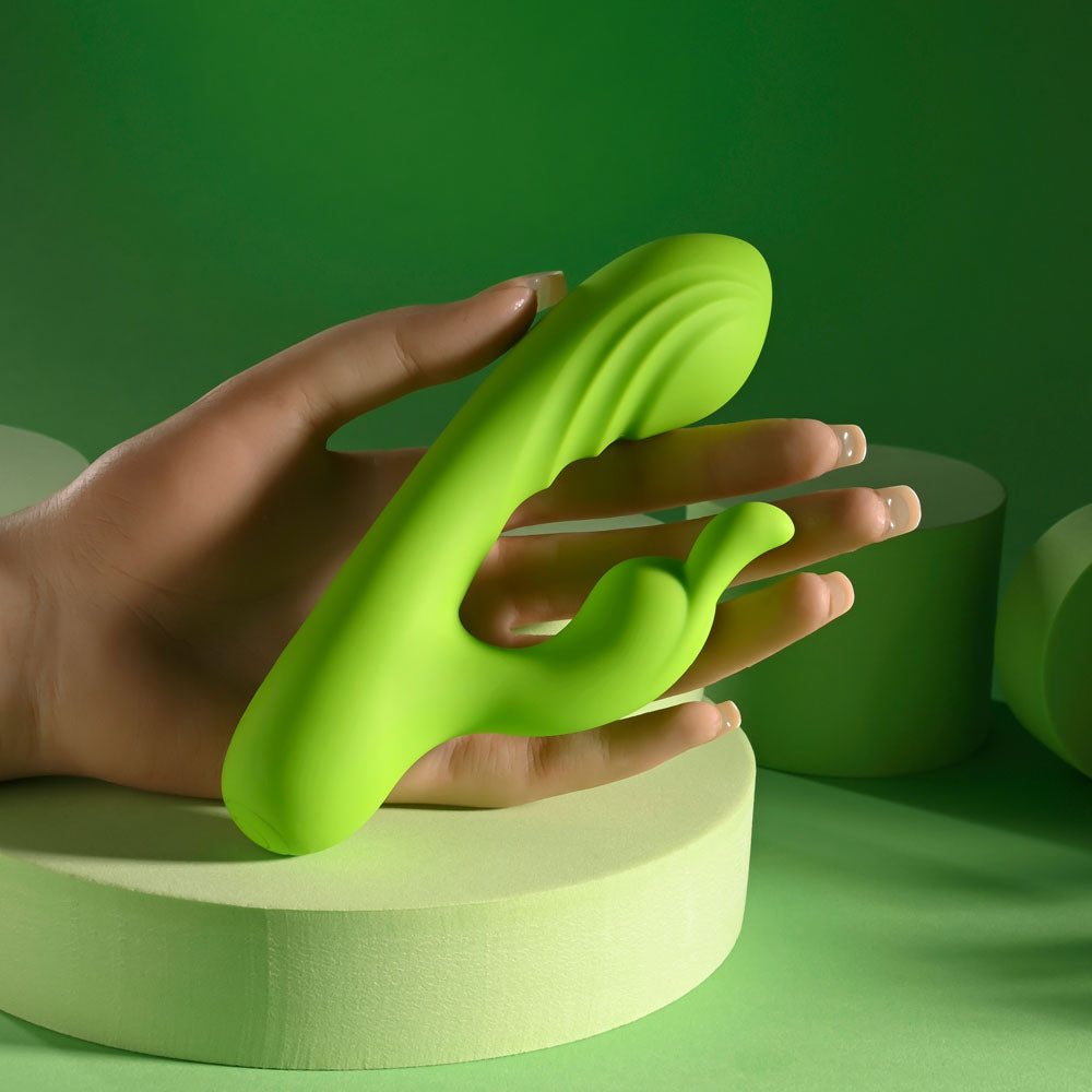 Evolved BRAT BUNNY -  16.2 cm USB Rechargeable Rabbit Vibrator held in hand, showcasing its vibrant green design.