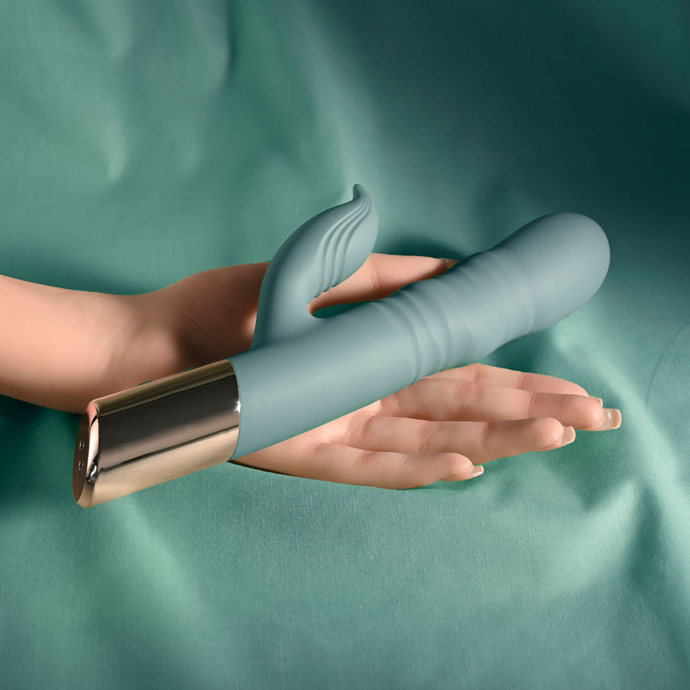 Evolved THE SHIMMY - USB Rechargeable Thrusting Rabbit Vibrator in hand, showcasing its sleek design and features.