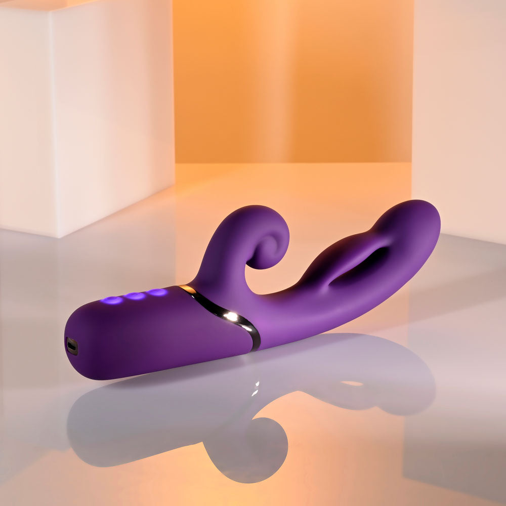 Evolved PLEASURE PUFF - 24.1 cm USB Rechargeable Inflatable Rabbit Vibrator in purple color on a sleek surface.