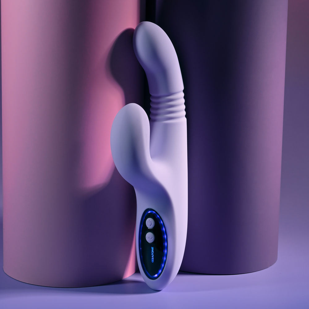 Evolved PEP TALK - 23.3 cm USB Rechargeable Thrusting Vibrator with Tapping Clitoral Stimulator against colorful backgrounds.