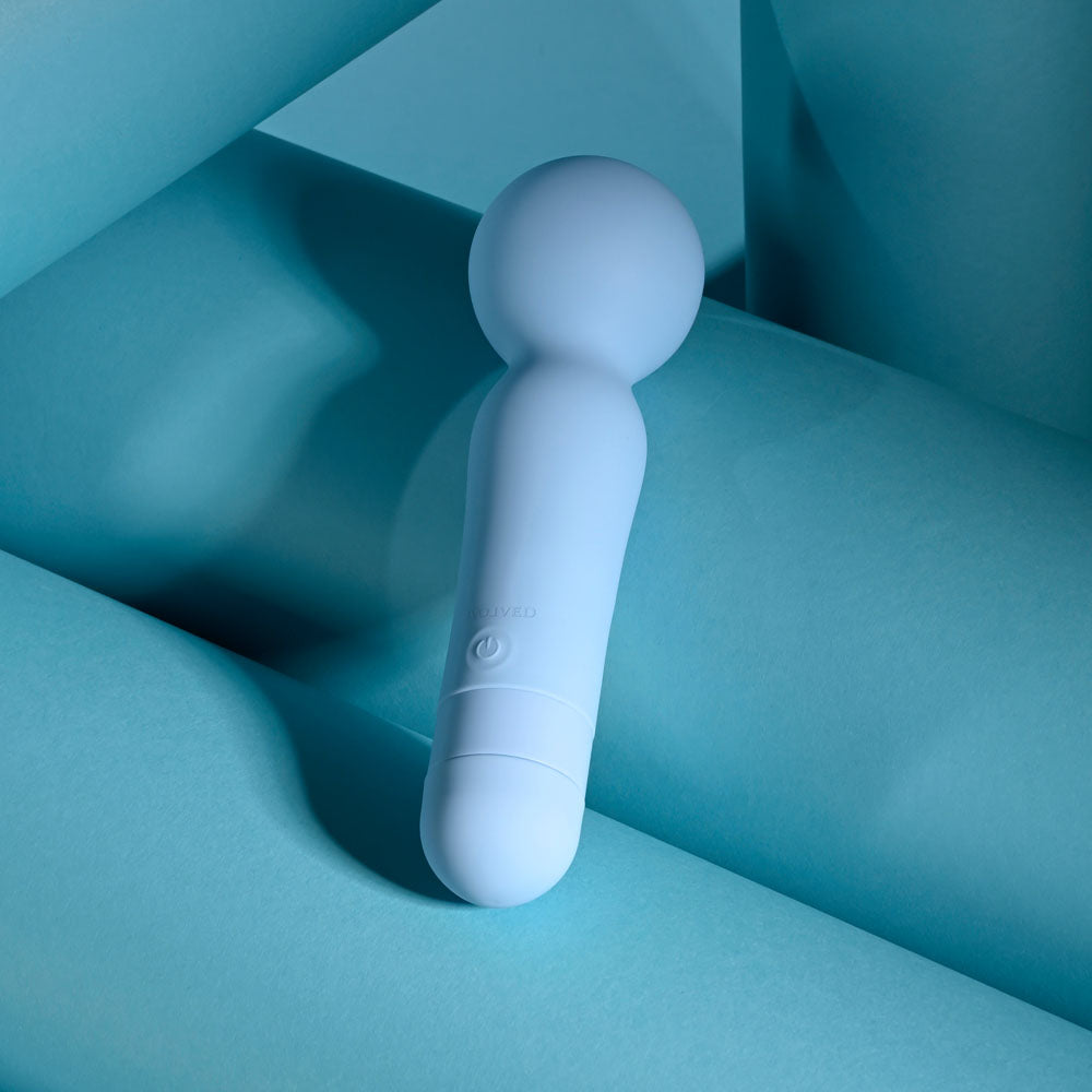 Evolved IRIS - 18.3 cm USB Rechargeable Massage Wand on blue background, perfect intimate essentials for her.