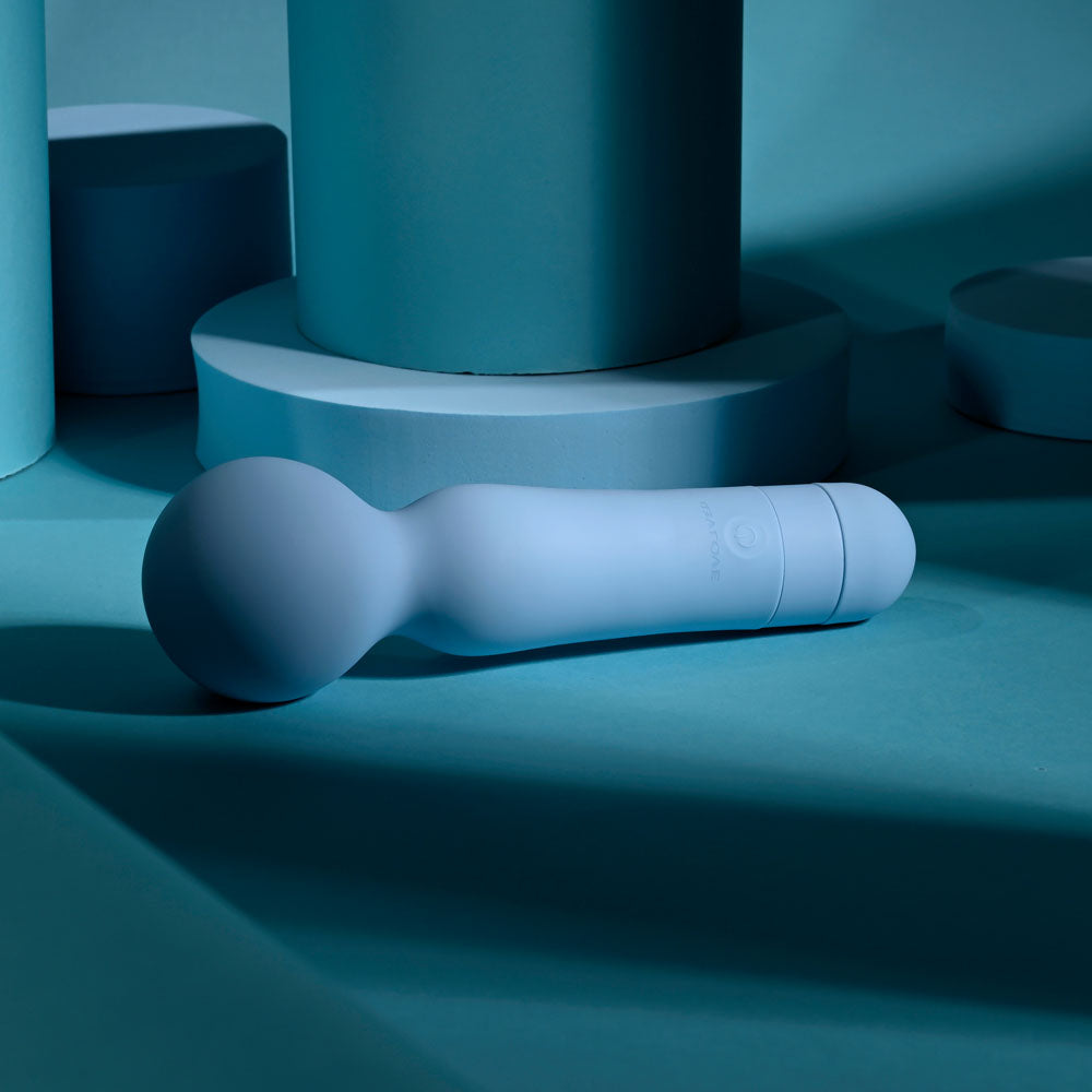 Evolved IRIS - 18.3 cm USB Rechargeable Massage Wand with soft silicone design on a blue background.