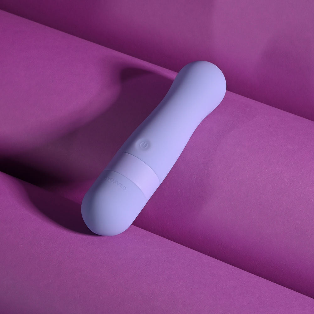 Evolved SQUISHY BULLET - 11 cm USB Rechargeable Bullet on vibrant purple background, showcasing intimate essentials for her.