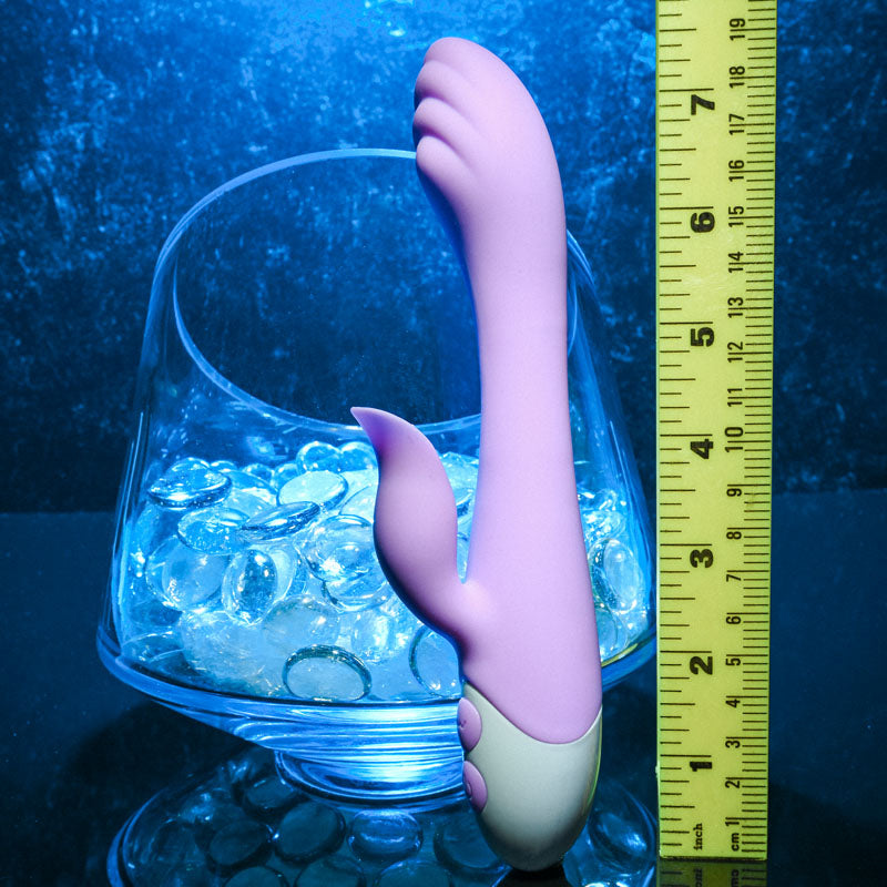 Evolved PLEASING PETAL - Lilac 19.7 cm USB Rechargeable Rabbit Vibrator placed next to a ruler for size reference.