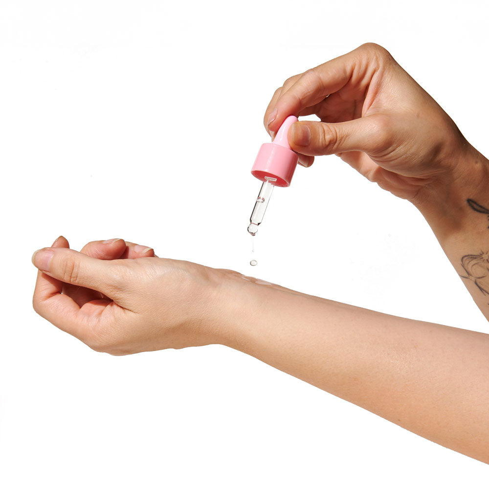 Eye Of Love Love In Bloom Sunny Daze Pheromone Perfume Oil - 20ml - Floral & Citrus Scented Pheromone Perfume Oil for Women to attract Men - 20 ml Dropper being applied on wrist.