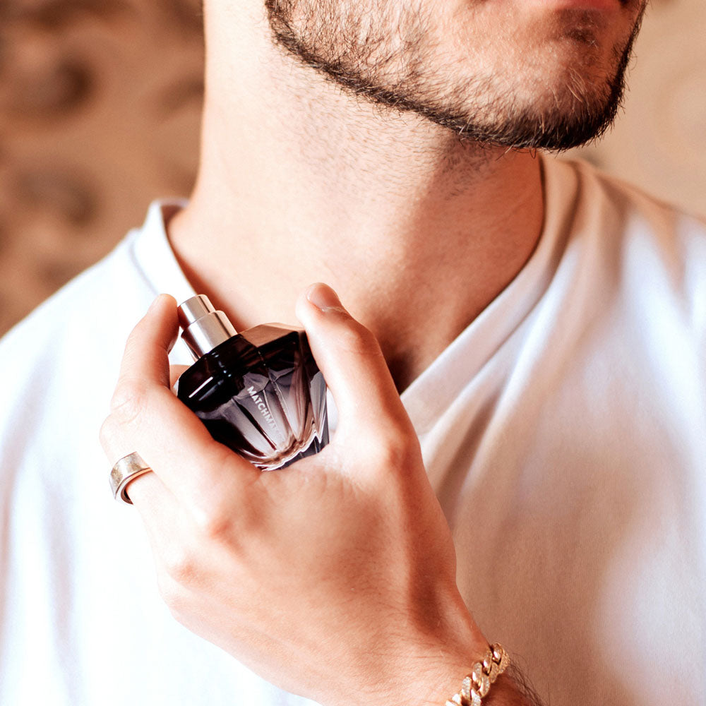 Man applying Eye of Love Matchmaker  Diamond LGTBQ - 30 ml - Pheromone Cologne for Men to attract Men - 30 ml Spray.