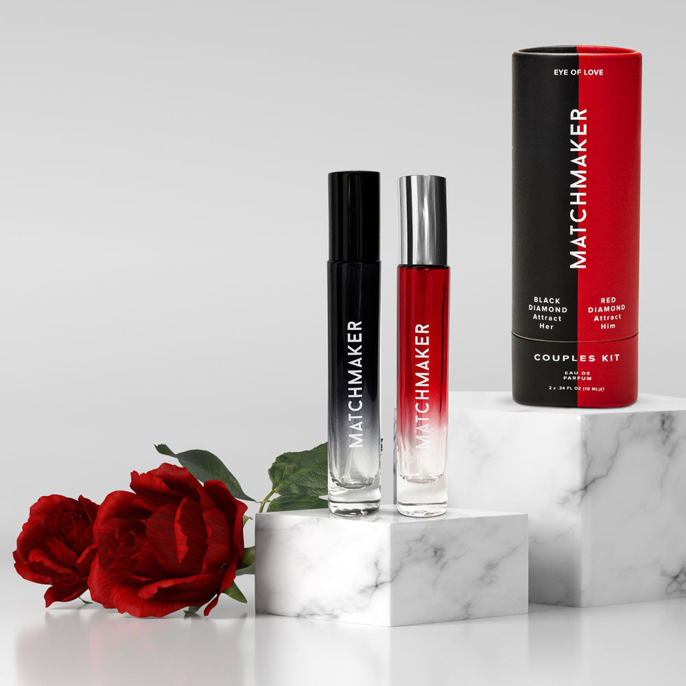 Eye of Love Matchmaker Couples Kit Pheromone Parfums - His and Hers Pheromone Parfum - 2 x 10ml Sprays on display with red rose.