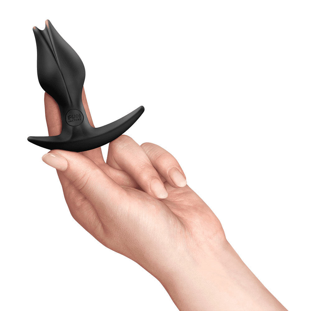 Fun Factory BOOTIE FEM  -  8.5 cm Butt Plug held in a hand, designed for comfortable anal and vaginal stimulation.