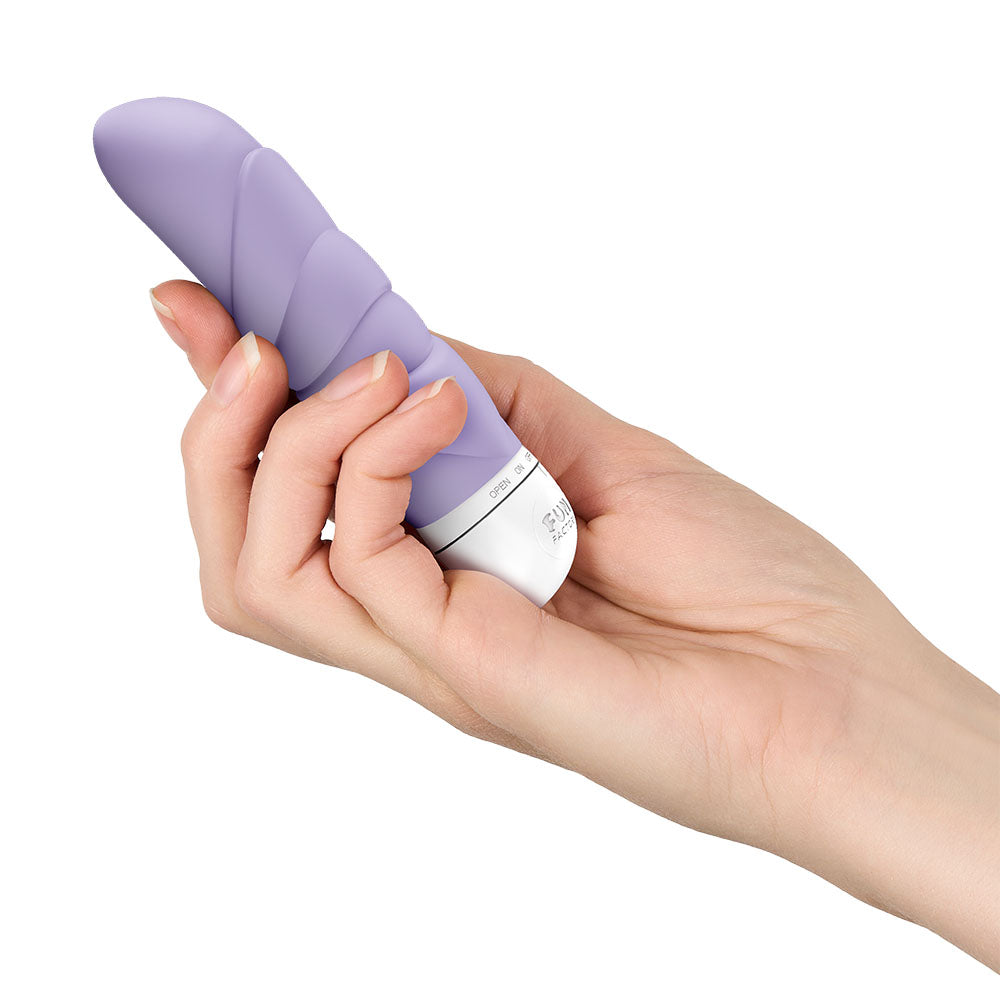 Fun Factory JAM - 12.2 cm Vibrator held in hand, showcasing its ergonomic design and premium silicone texture.