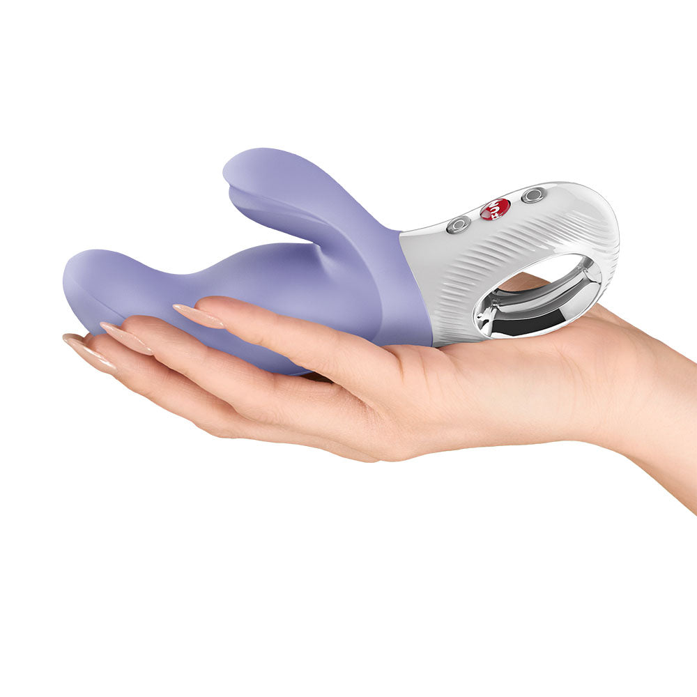 Fun Factory MISS BI - 17 cm USB-C Rechargeable Vibrator held in a hand, designed for intimate essentials for her.