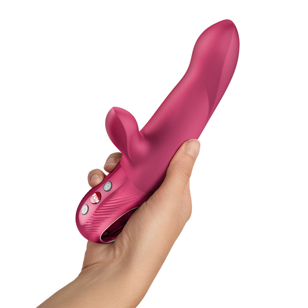 Fun Factory BI STRONIC ARC Raspberry - Raspberry 21.6 cm USB-C Rechargeable Thrusting Vibrator held in hand.